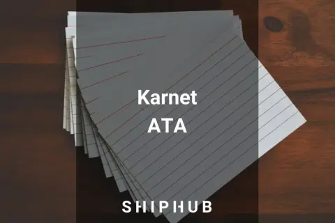 Stos kartek z napisem "Karnet ATA" na drewnianym tle.